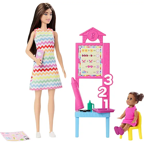 Lehrerin mit br�netter Modepuppe mit gemustertem Kleid